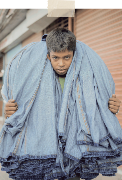 kid carrying jeans