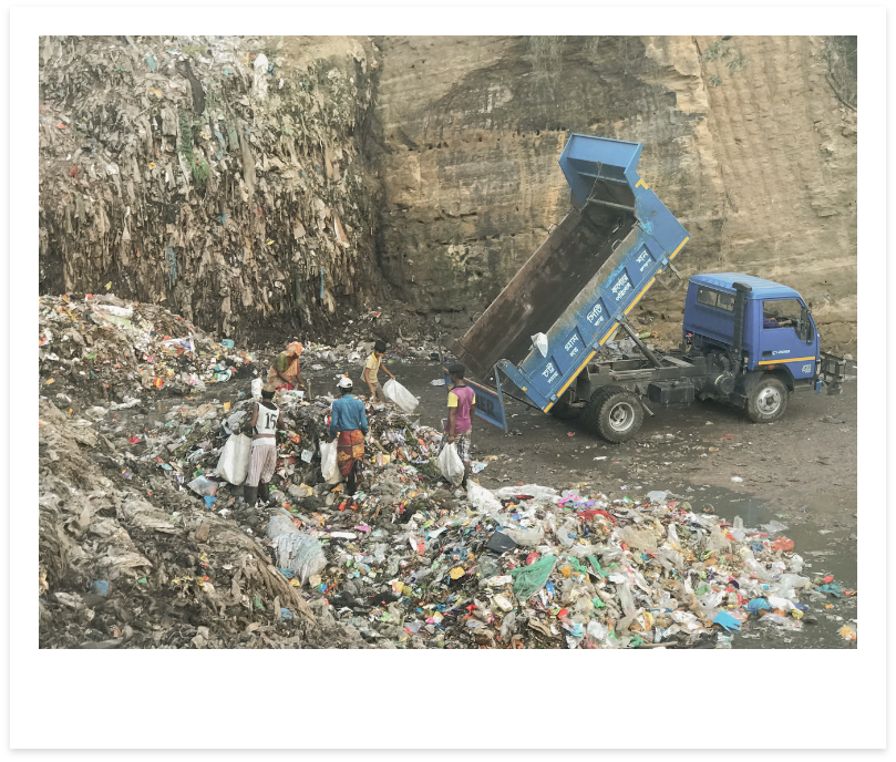 image of truck dumping clothing